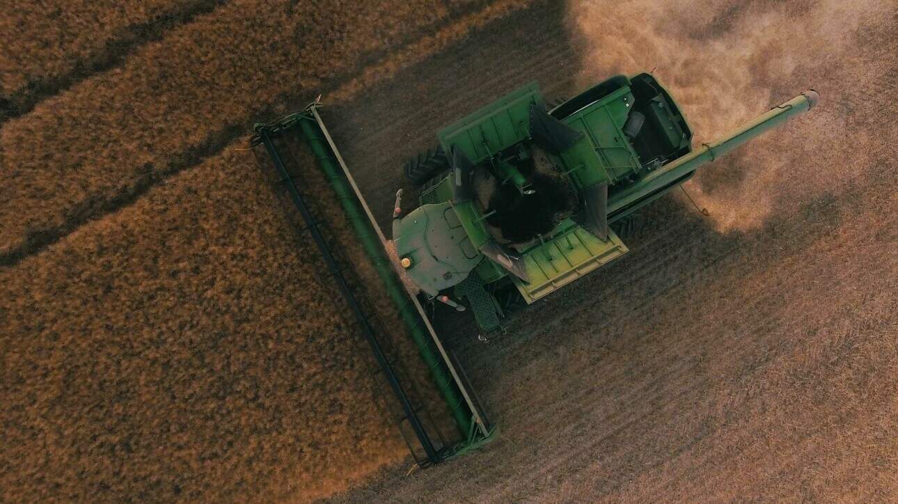 An aerial view of a tractor in a field.